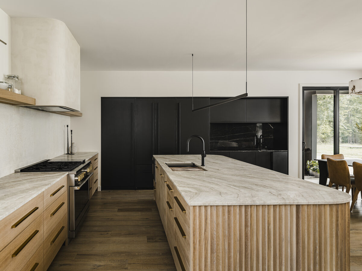 Lumen House kitchen with black and white oak cabinetry