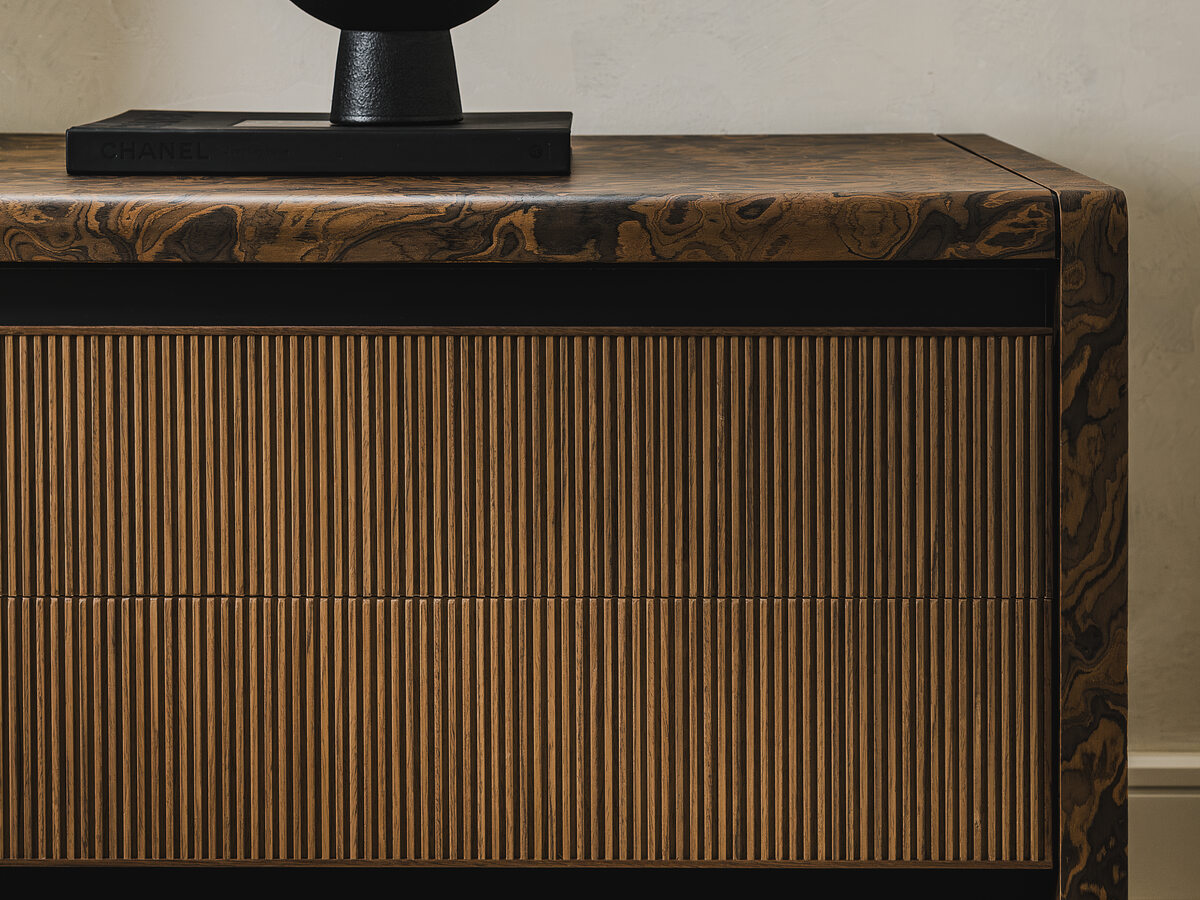 Fluted dresser with burl wood top detail